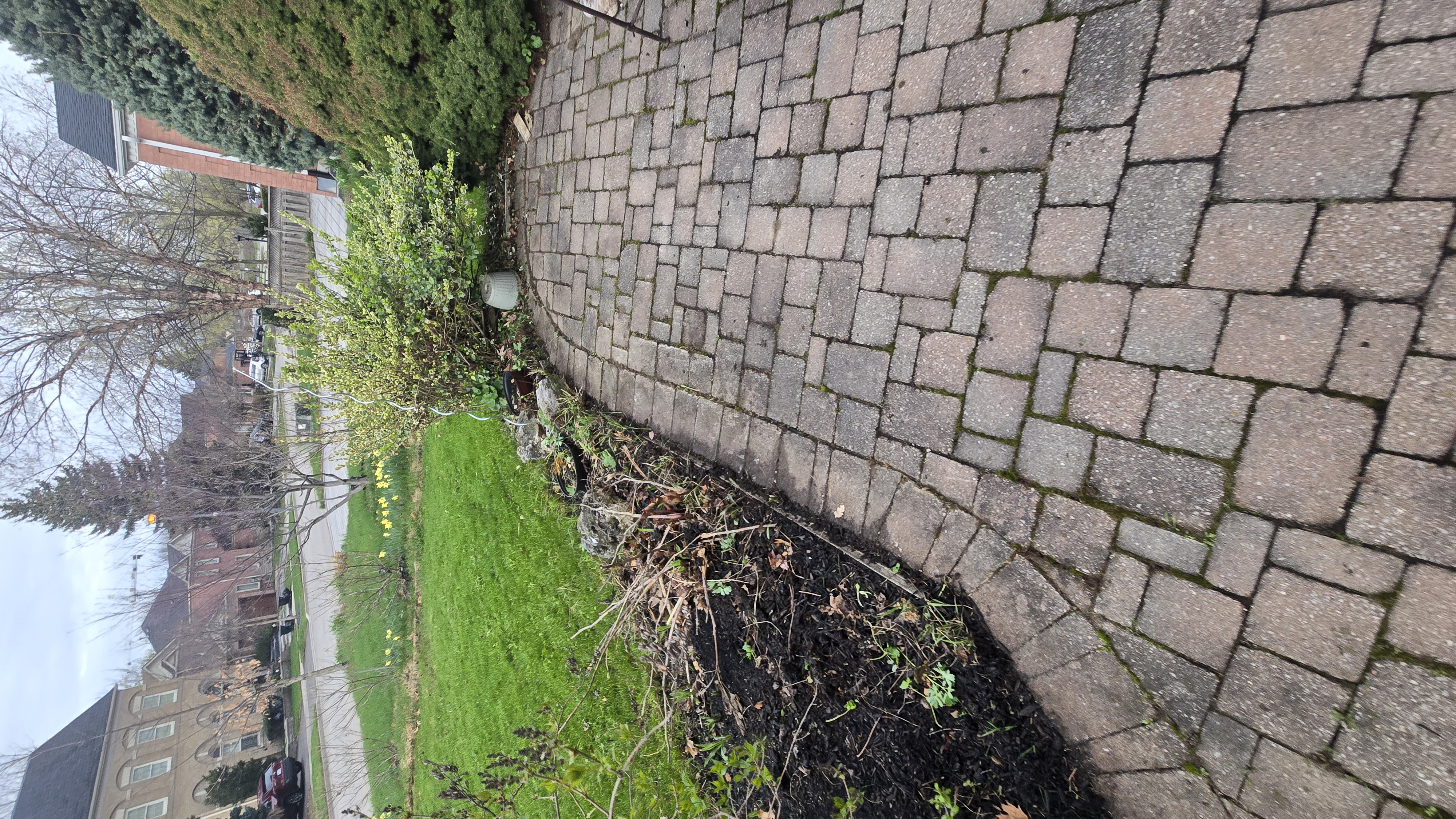Paver driveway with garden beds